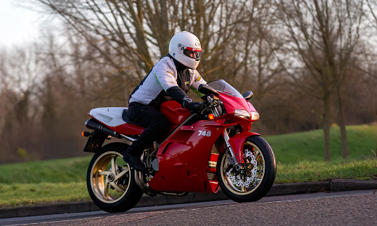 Stony Stratford,UK Jan 1st 2024.2000 red Ducati 748 motorcycle arriving at Stony Stratford for the annual New Years Day vintage and classic vehicle festival.