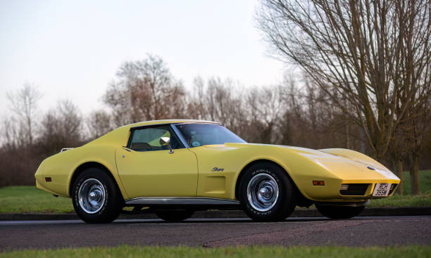 Chevrolet Corvette Stony Stratford,UK Jan 1st 2024. 1974 yellow Chevrolet Corvette car arriving at Stony Stratford for the annual New Years Day vintage and classic vehicle festival. Chevrolet stock pictures, royalty-free photos & images