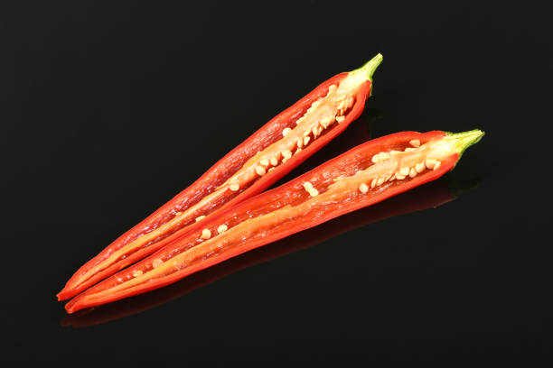 Red chili pepper isolated on  black background. High resolution photo. Full depth of field.