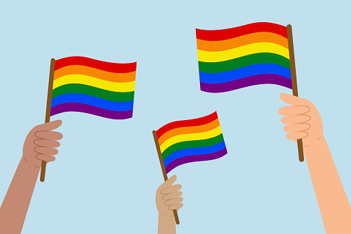 Diverse hands raising LGBT flags. People holding rainbow flags. Vector illustration in flat style on blue background.
