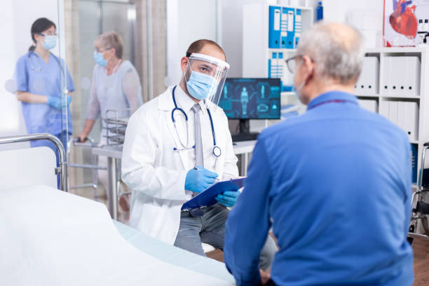 istock Doctor talking about covid infection 1907711735