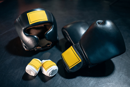 flat lay of boxing gloves and helmet for protective on training