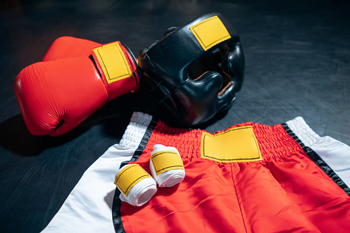 flat lay of boxing gloves and helmet for protective on training