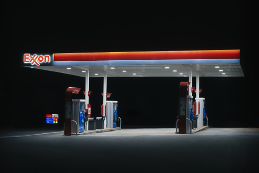 Fort Mill, South Carolina, United States, 28 Dec 2023:  An Exxon gas pump area at night - Illuminated pumps for after-hours refueling convenience.