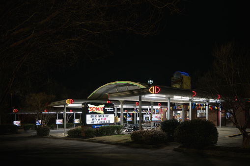 Fort Mill, South Carolina, United States - 28 Dec 2023:  Sonic Drive-In at night in Fort Mill, SC - Neon-lit vibes for late-night cravings.