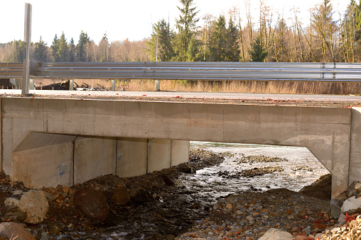 water flows under the road leading to the Olympic National Park along the Hoh River, this newly installed culvert helps salmon reach spawning grounds that had been blocked by the old culverts