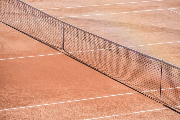 istock View with a net on the clay tennis court 1907786563