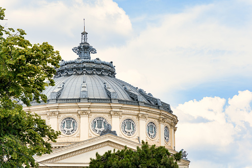 Bucharest, Romania - June 17 2023: View of the Romanian Athenaeum( Ateneul Roman) a prestigious concert hall and one of the most beautiful buildings in the city.