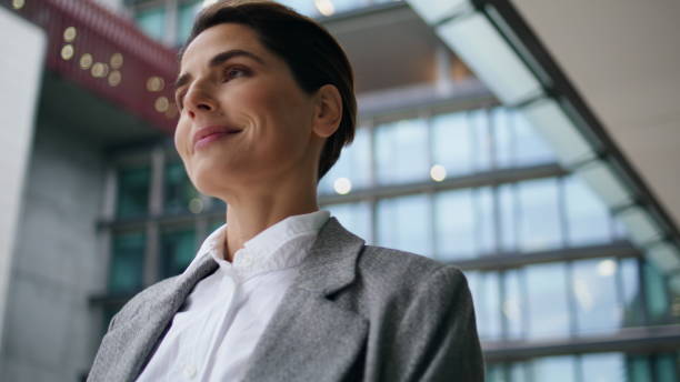 istock Happy executive walking downtown closeup. Smiling beautiful employee posing 1907792779