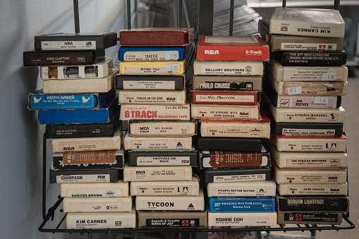 Fort Mill, South Carolina, United States, 31 Dec 2023:  In a Fort Mill, SC comic book store called Collecting Problems, discover four stacks of 8 track tapes.