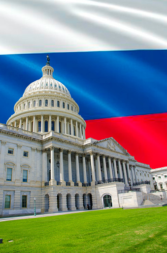 Washington Capitol with Russian flag in background to imply that Russian government in manipulating the American elections