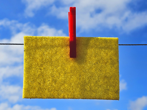 colorful of paper note with a pin against the blue sky