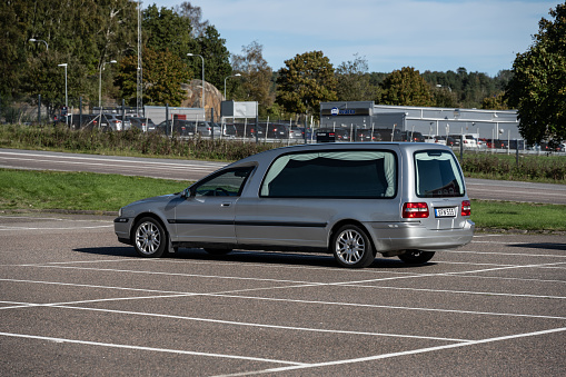 Gothenburg, Sweden - October 08 2023: Silver Volvo funeral hearse on a parking lot.