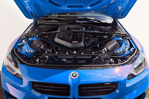 Engine of blue BMW M2 Coupe. Open bonet. Engine R6, 3.0L, 460 HP, 550 Nm Katowice, Poland, 10.06.2023