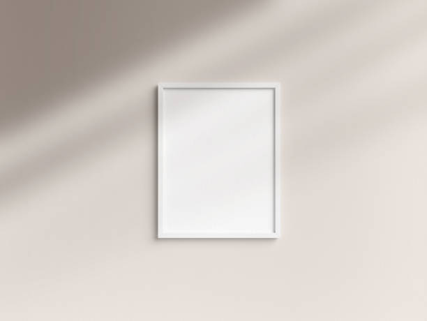 istock Empty Letter size white photo frame template hanging on the wall 1907970886