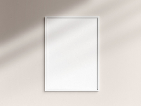 Blank A3 white photo frame template hanging on the wall
5x7 ratio