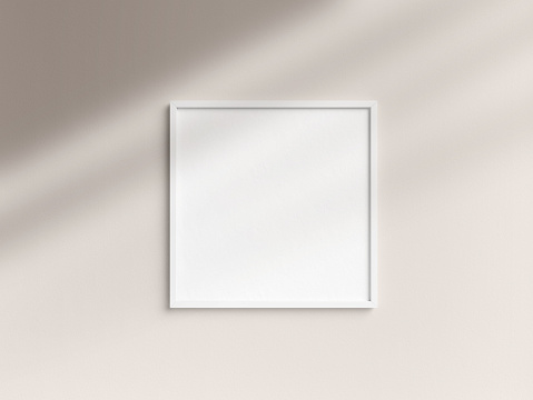 White blank vertical picture or photo frame on white wall with shadows, white colorless picture frame template, art frame mock-up 3D illustration