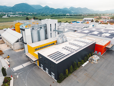 Aerial view of industrial area interwoven with a network of structures, machinery, and infrastructure, complex of industrial activity