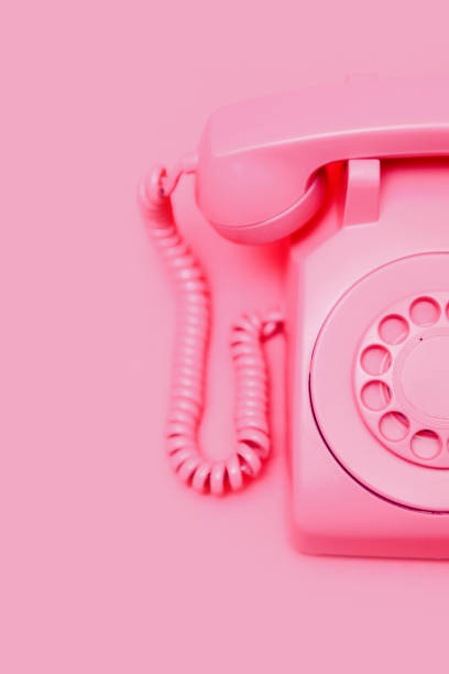 istock Retro Pink Rotary Telephone on Pink Background 1907998958