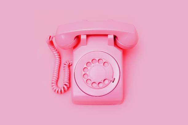 istock Retro Pink Rotary Telephone on Pink Background 1907999994