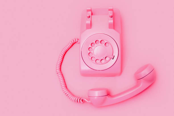 istock Retro Pink Rotary Telephone on Pink Background 1908001041