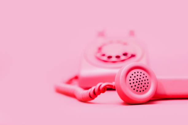 istock Retro Pink Rotary Telephone on Pink Background 1908001569