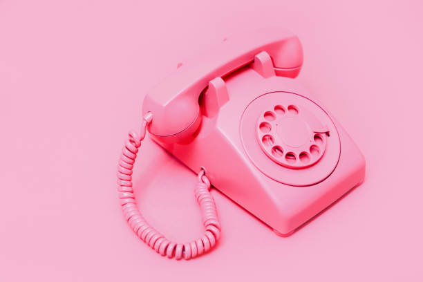 istock Retro Pink Rotary Telephone on Pink Background 1908002082
