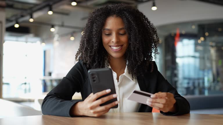 Young woman holding credit card