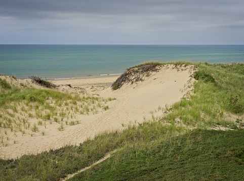 Beacon in sandy dunes of the North Sea. Belgium