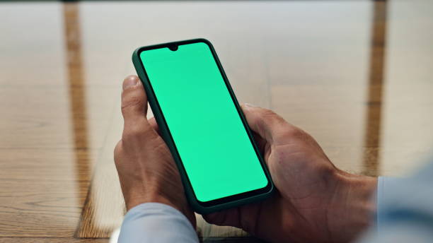 istock Man hands hold chromakey mobile in office closeup. Unknown ceo checking messages 1908041614