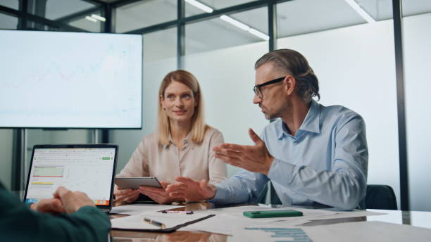 istock Emotional professional gesturing meeting office. Colleagues presenting startup 1908071545