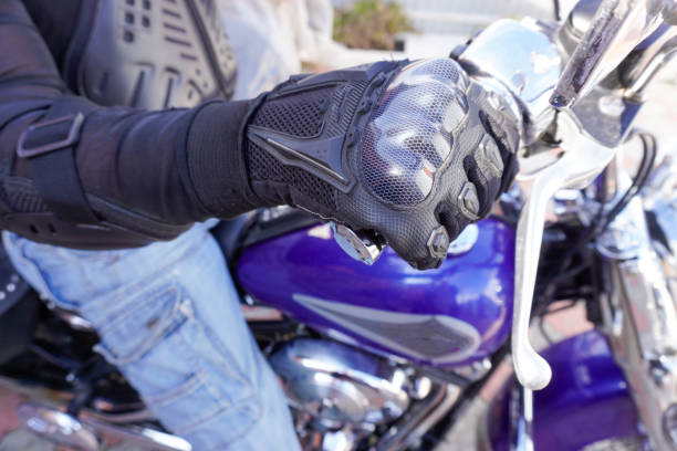 istock Motorcyclist in protection on a motorcycle close-up 1908115239