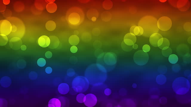 Colorful glowing bokeh particles animation.Colorful or rainbow background.Moving bubbles colorful blurred animation backdrop.Rainbow flag,LGBT pride flag or gay pride flag.