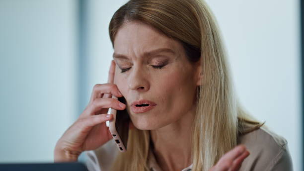 istock Nervous manager talking phone at work portrait. Furious woman gesturing hands 1908126809