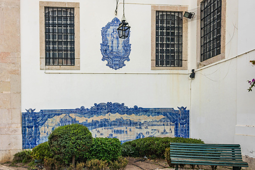 Lisbon, Portugal - November 26th 2023:  Alfama district, Miradouro de Santa Luzia, historical azulejos panels on the wall of Santa Luzia church