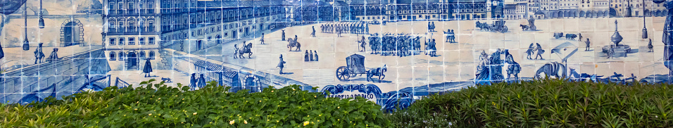 Lisbon, Portugal - November 26th 2023:  Alfama district, Miradouro de Santa Luzia, historical azulejos panels on the wall of Santa Luzia church, banner