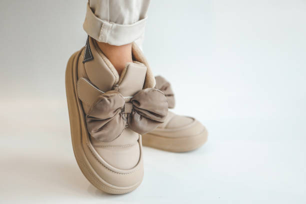 istock Fashionable boots on a girl close-up 1908169299