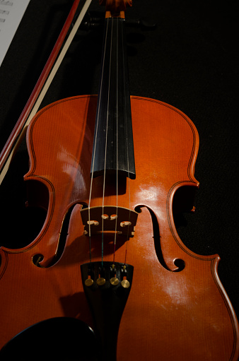 a violin with its bow, a classical musical instrument. classical and chamber musical instrument