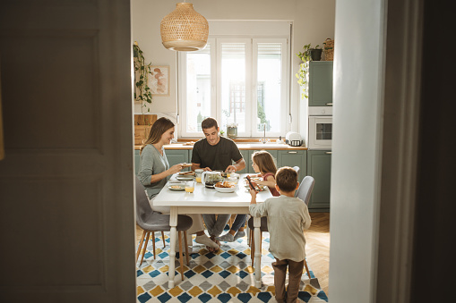 Shot of a family having breakfast together