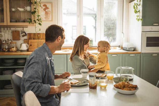 istock Happy family enjoying in breakfast at home 1908198521
