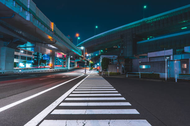 istock Highway bridge and city lights at midnight in Tokyo 1908201134