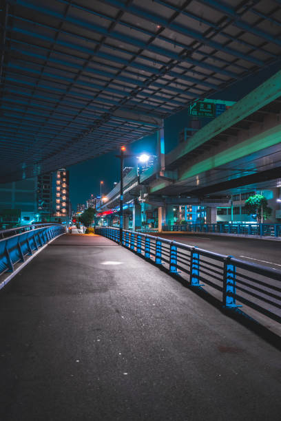 istock Highway bridge and city lights at midnight in Tokyo 1908201670