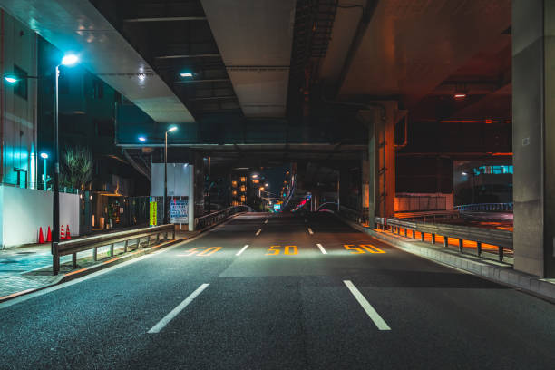 istock Highway bridge and city lights at midnight in Tokyo 1908203199