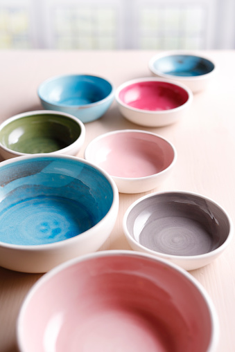 Close up of colorful ceramic bowls on a table