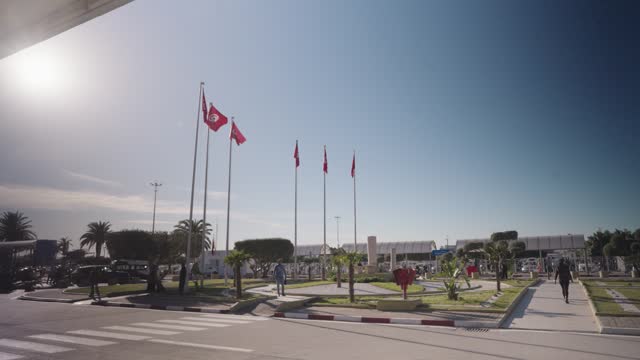 Outside Tunis Carthage International Airport with many Flags Tunis, Tunisia