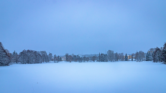 A public park during a winter day, the city of Lahti in the background.