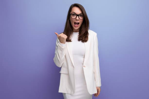istock confident young brunette woman in white dress 1908258770