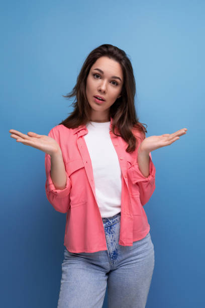 istock charming informal brunette woman with hair below her shoulders posing as a model 1908259299