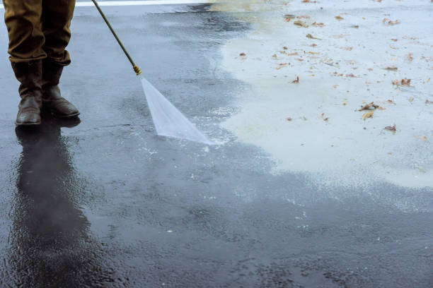 istock A street is sprayed clean using pressurized water, wet washing to clean it 1908284872