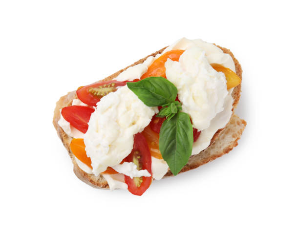istock Delicious sandwich with burrata cheese and tomatoes isolated on white, top view 1908320511